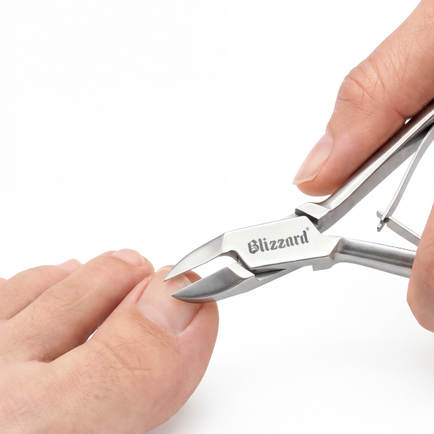 Nail clippers with 'Blizzard' branding being used on a white background