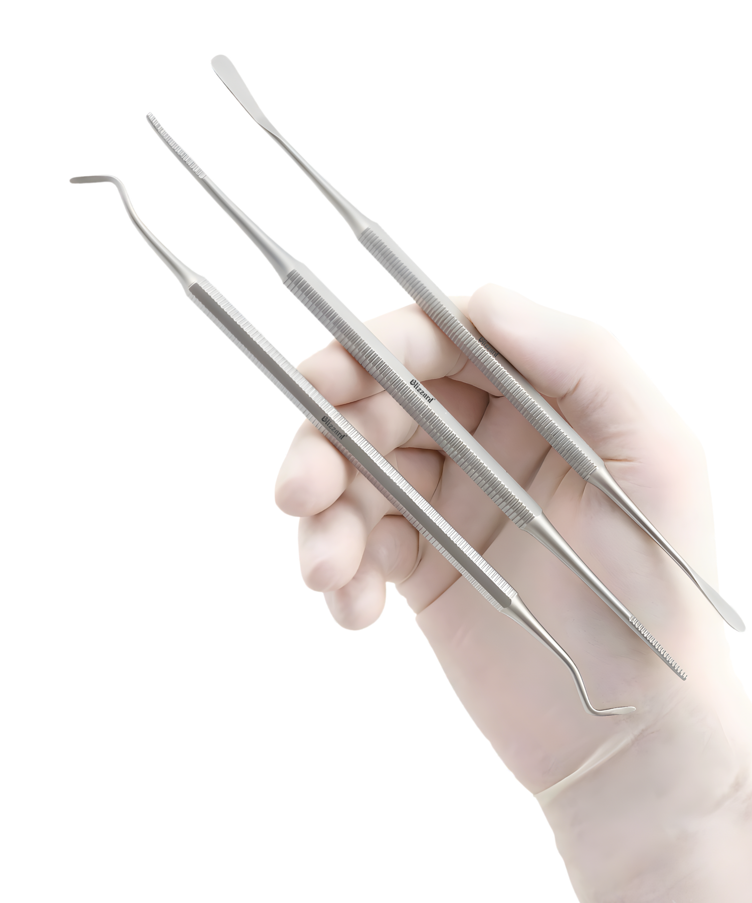 Set of dental tools held by a gloved hand on a white background