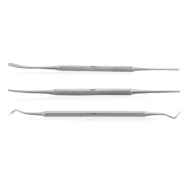 Three dental tools on a white background