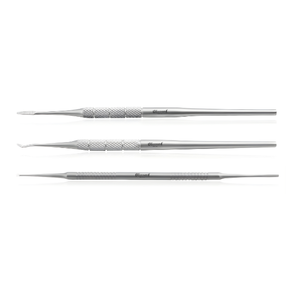 Three metal dental tools on a white background