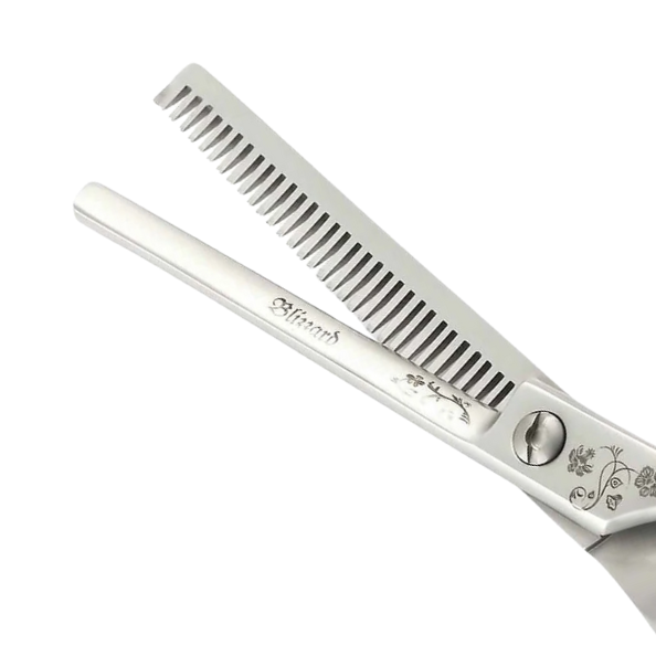 Hair cutting scissors with comb attachment on a white background